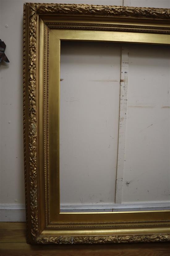 A large 19th century giltwood and gesso picture frame with oak leaf moulding, aperture 85 x 110cm, overall 120 x 146cm